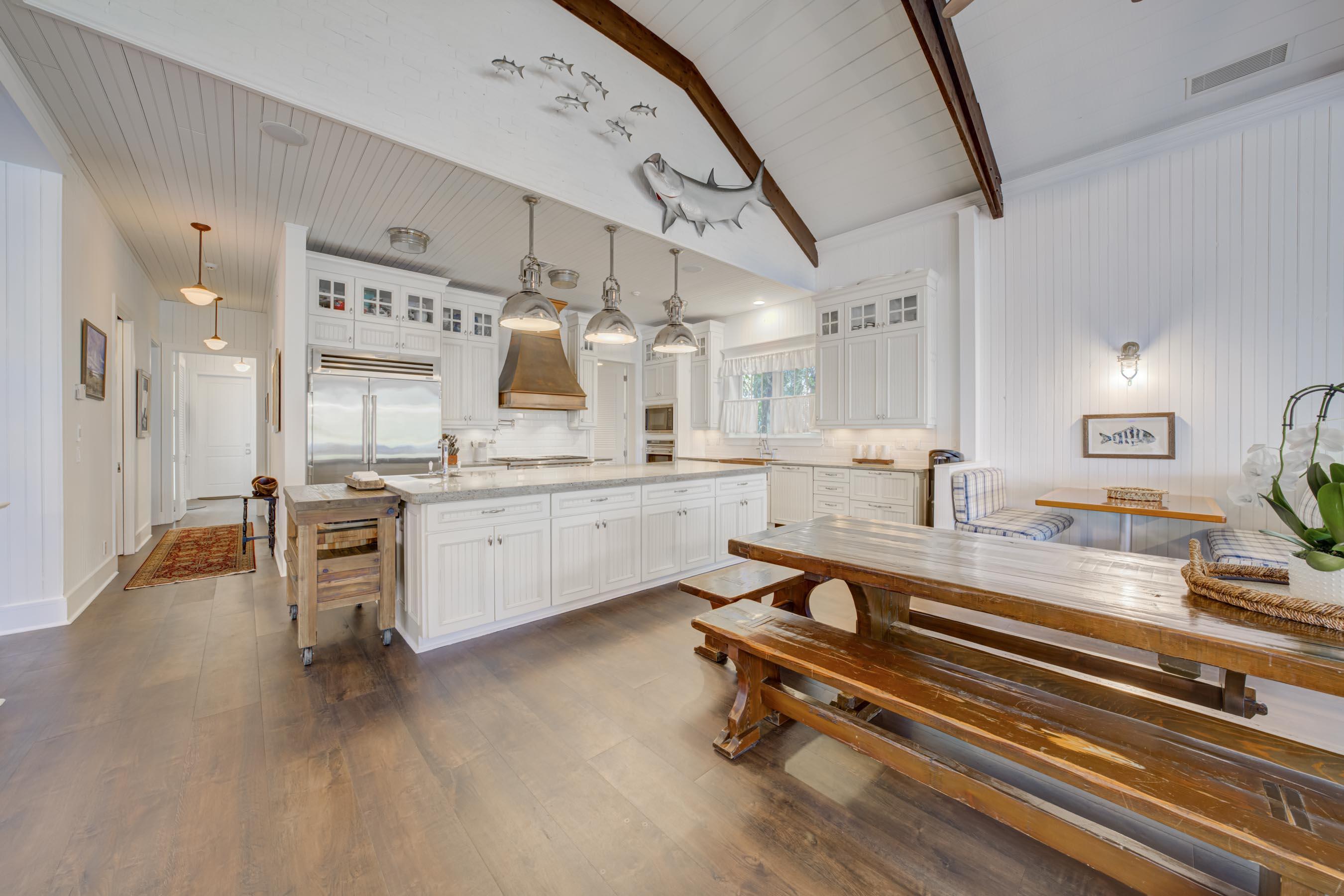 5270 Pennock Point Road Jupiter, FL 33458 - Photo 56 of 60 a large white kitchen with sink stove and refrigerator
