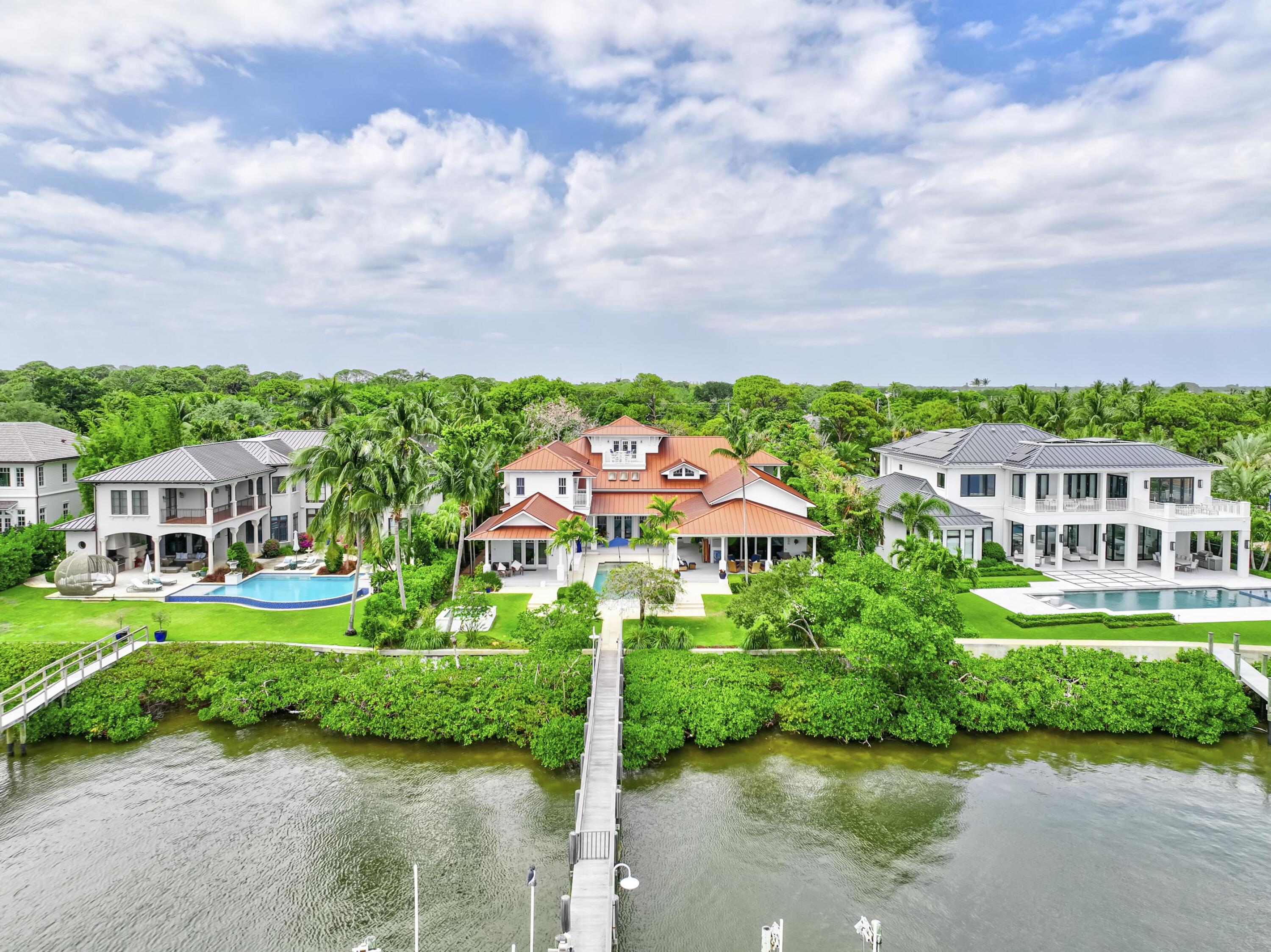 5270 Pennock Point Road Jupiter, FL 33458 - Photo 60 of 60 a view of a garden with a building in the background