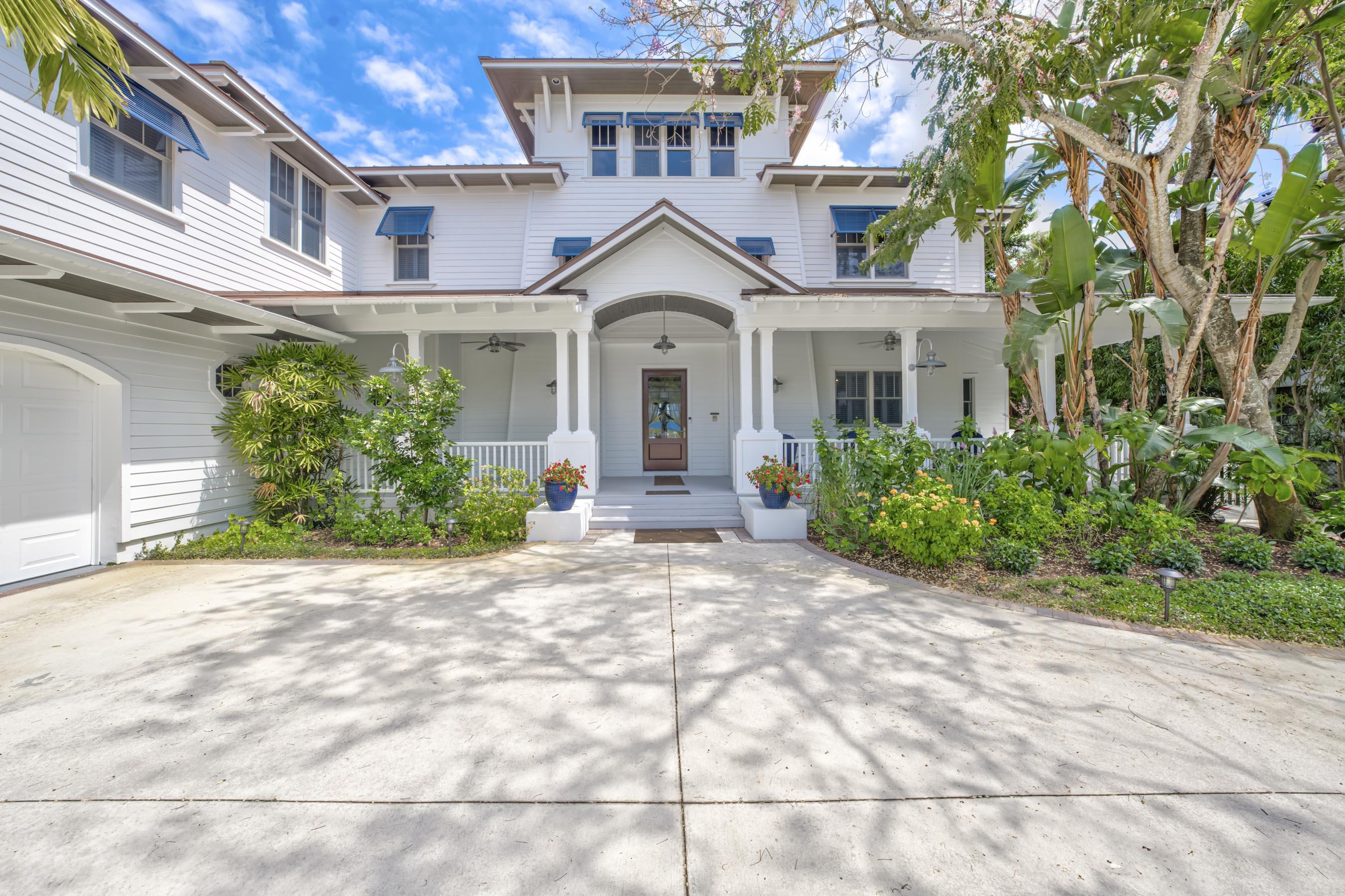5270 Pennock Point Road Jupiter, FL 33458 - Photo 6 of 60 a front view of a house with garden