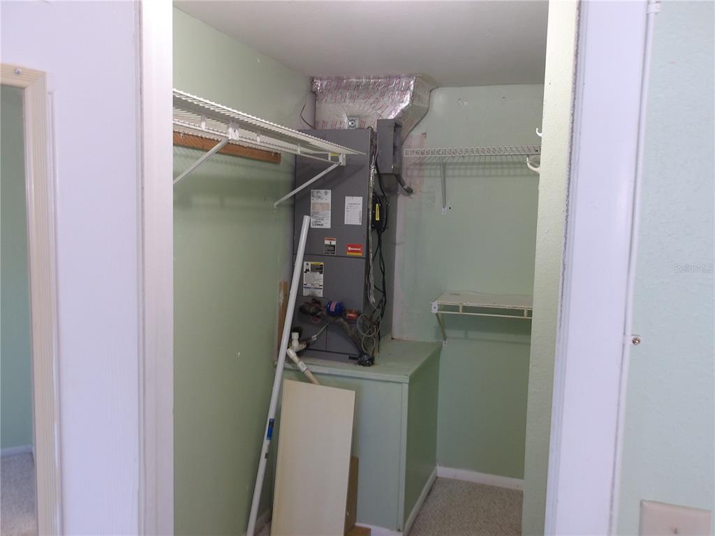 4140 Passport Lane, Unit 101 New Port Richey, FL 34653 - Photo 13 of 40 a room with storage and utility