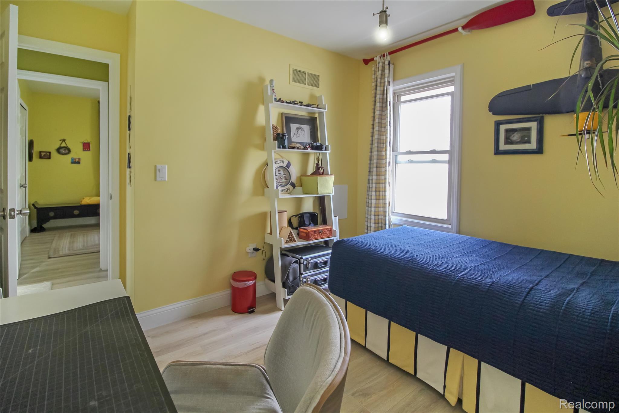 5953 Cooper Street Taylor, MI 48180 - Photo 7 of 33 Room with light yellow walls and wood-finish flooring