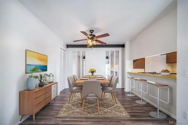 a dining room with furniture and window