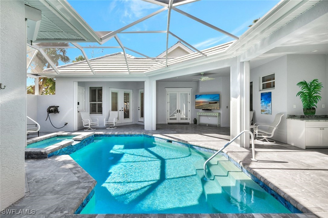 2450 Wulfert Road Sanibel, FL 33957 - Photo 9 of 44 a view of a house with backyard porch and furniture