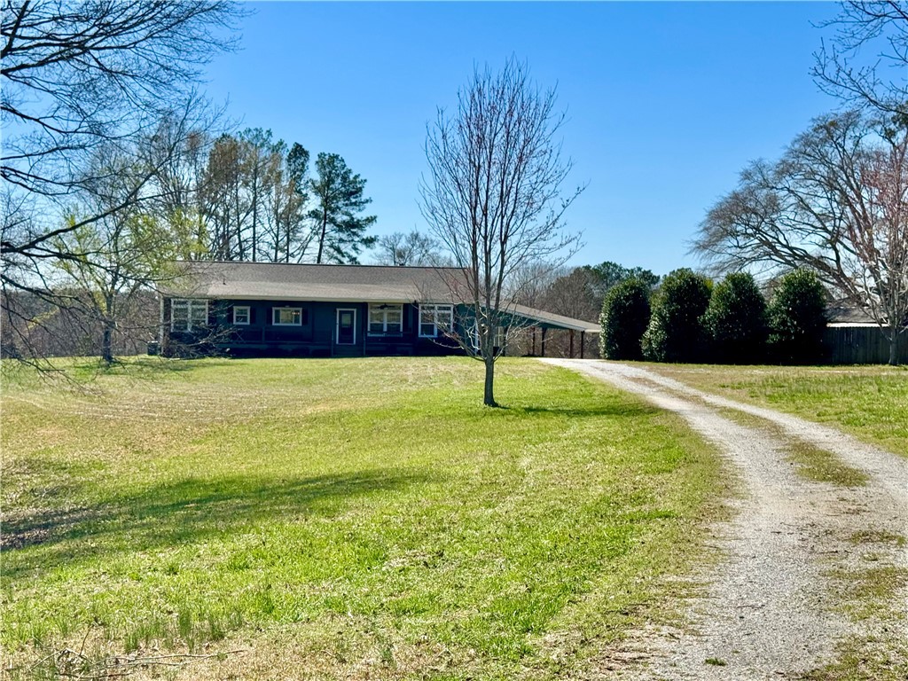 212 Holland Ford Road Pelzer, SC 29669 - Photo 1 of 46 Front and gravel drive