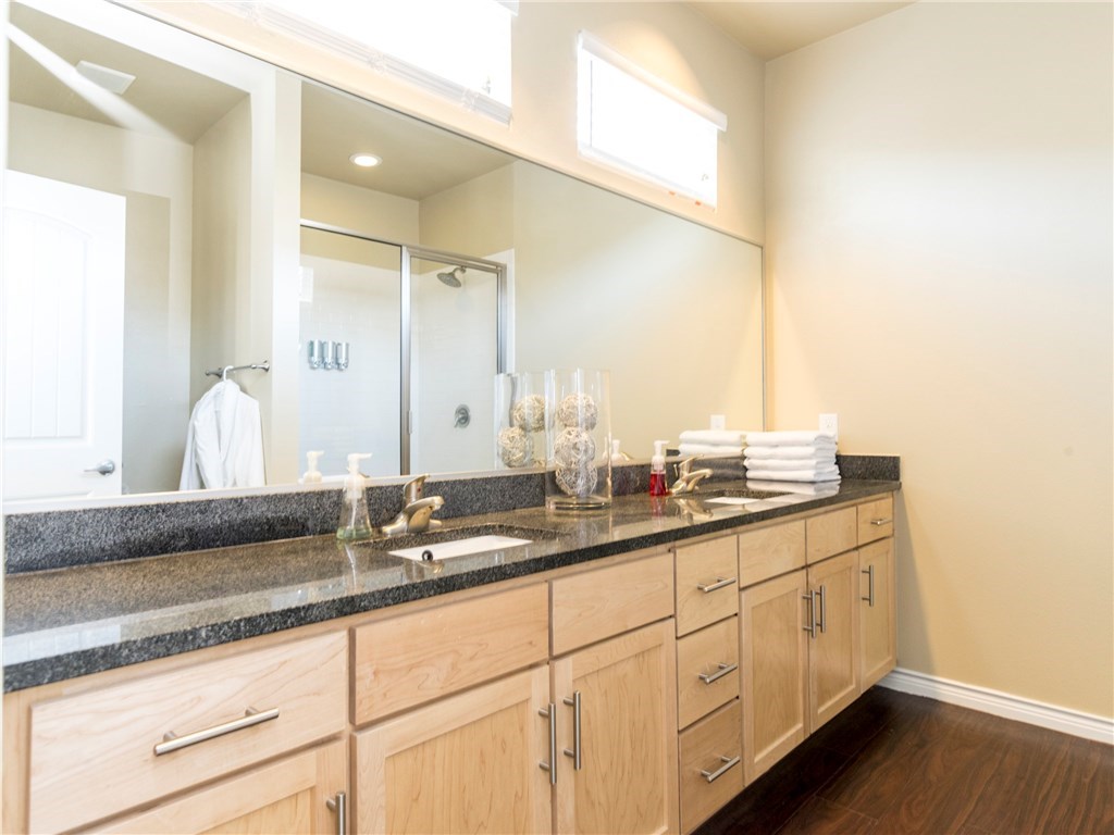 2606 Wilson Street, Unit 1601 Austin, TX 78704 - Photo 12 of 14 a bathroom with double sink and a mirror