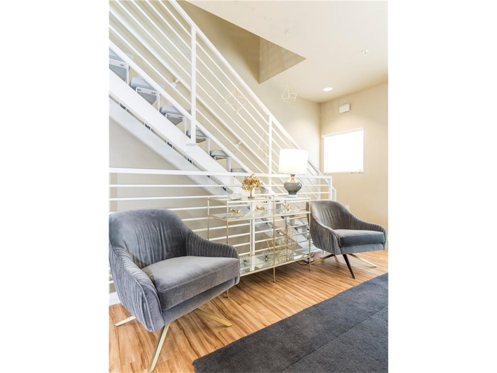 2606 Wilson Street, Unit 1601 Austin, TX 78704 - Photo 13 of 14 a view of a hallway with couches and a coffee table