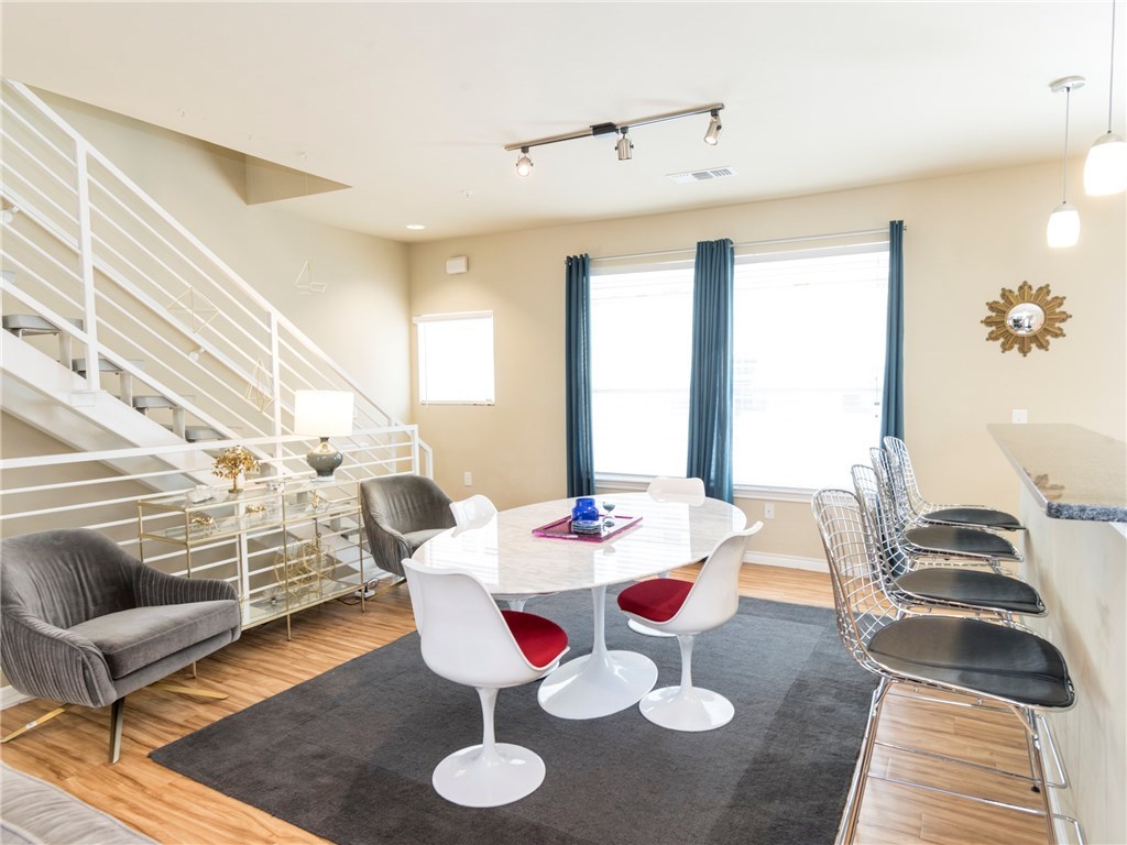 2606 Wilson Street, Unit 1601 Austin, TX 78704 - Photo 3 of 14 a view of a dining room with furniture and wooden floor