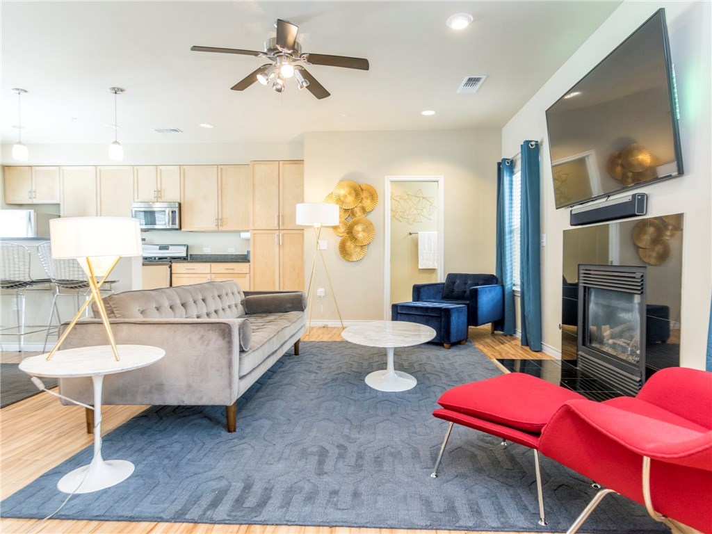 2606 Wilson Street, Unit 1601 Austin, TX 78704 - Photo 6 of 14 a living room with furniture and wooden floor