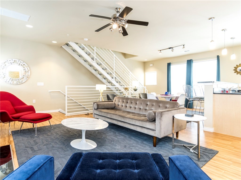 2606 Wilson Street, Unit 1601 Austin, TX 78704 - Photo 7 of 14 a living room with furniture and wooden floor