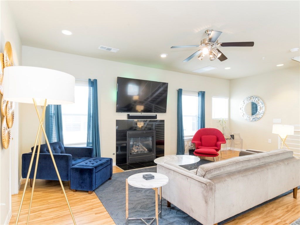 2606 Wilson Street, Unit 1601 Austin, TX 78704 - Photo 8 of 14 a living room with furniture and a flat screen tv