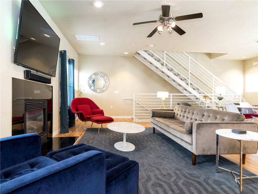 2606 Wilson Street, Unit 1601 Austin, TX 78704 - Photo 9 of 14 a living room with furniture and wooden floor