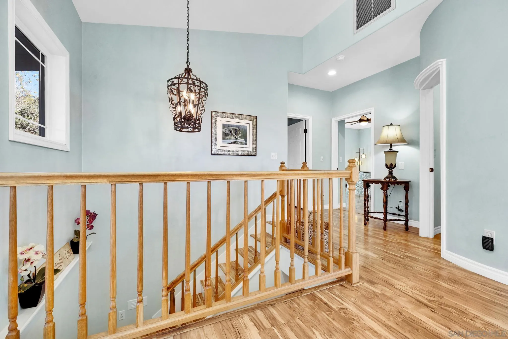 17735 Harrison Park Road Julian, CA 92036 - Photo 15 of 43 a view of a hallway with wooden floor and stairs