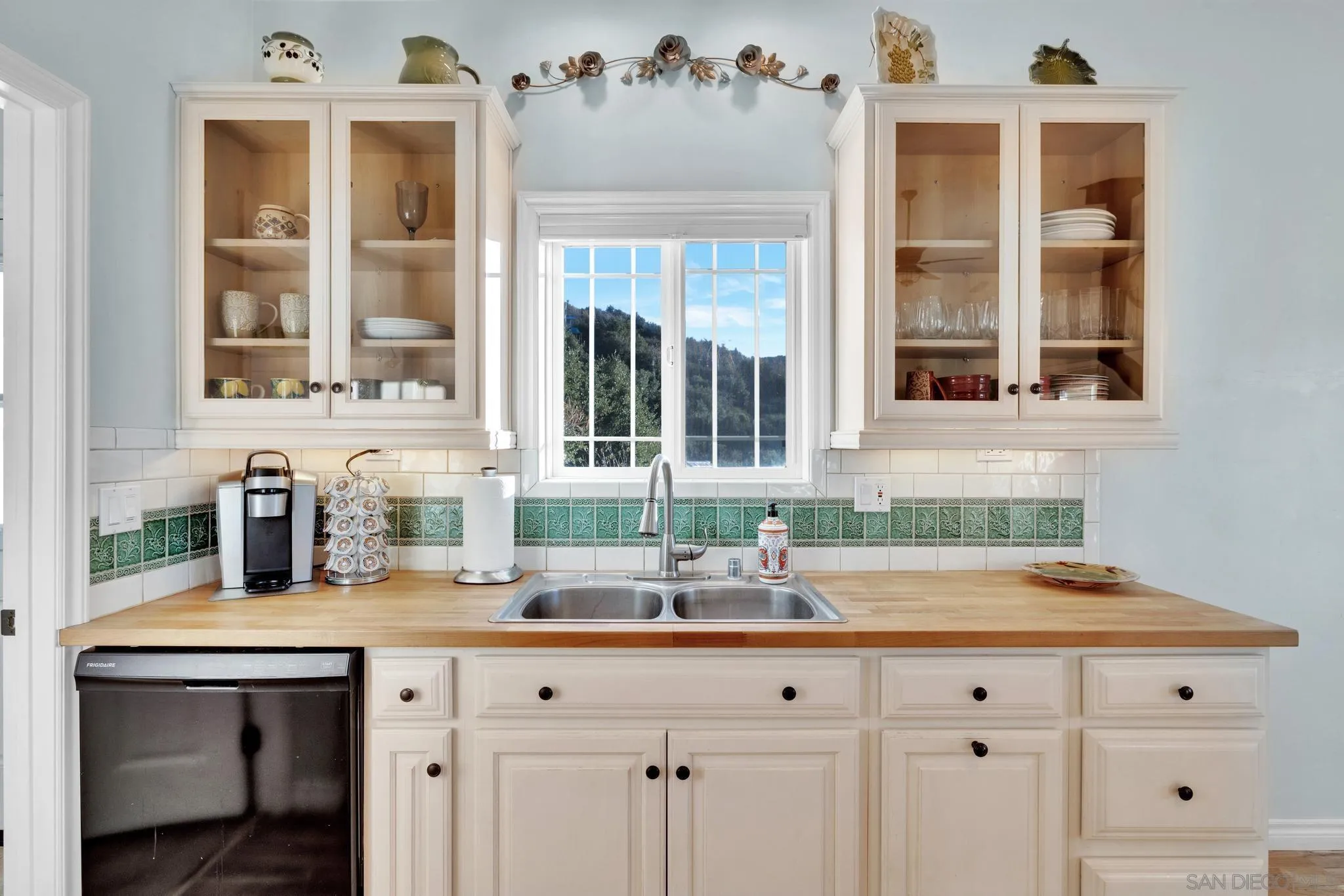 17735 Harrison Park Road Julian, CA 92036 - Photo 16 of 43 a kitchen with a sink and cabinets