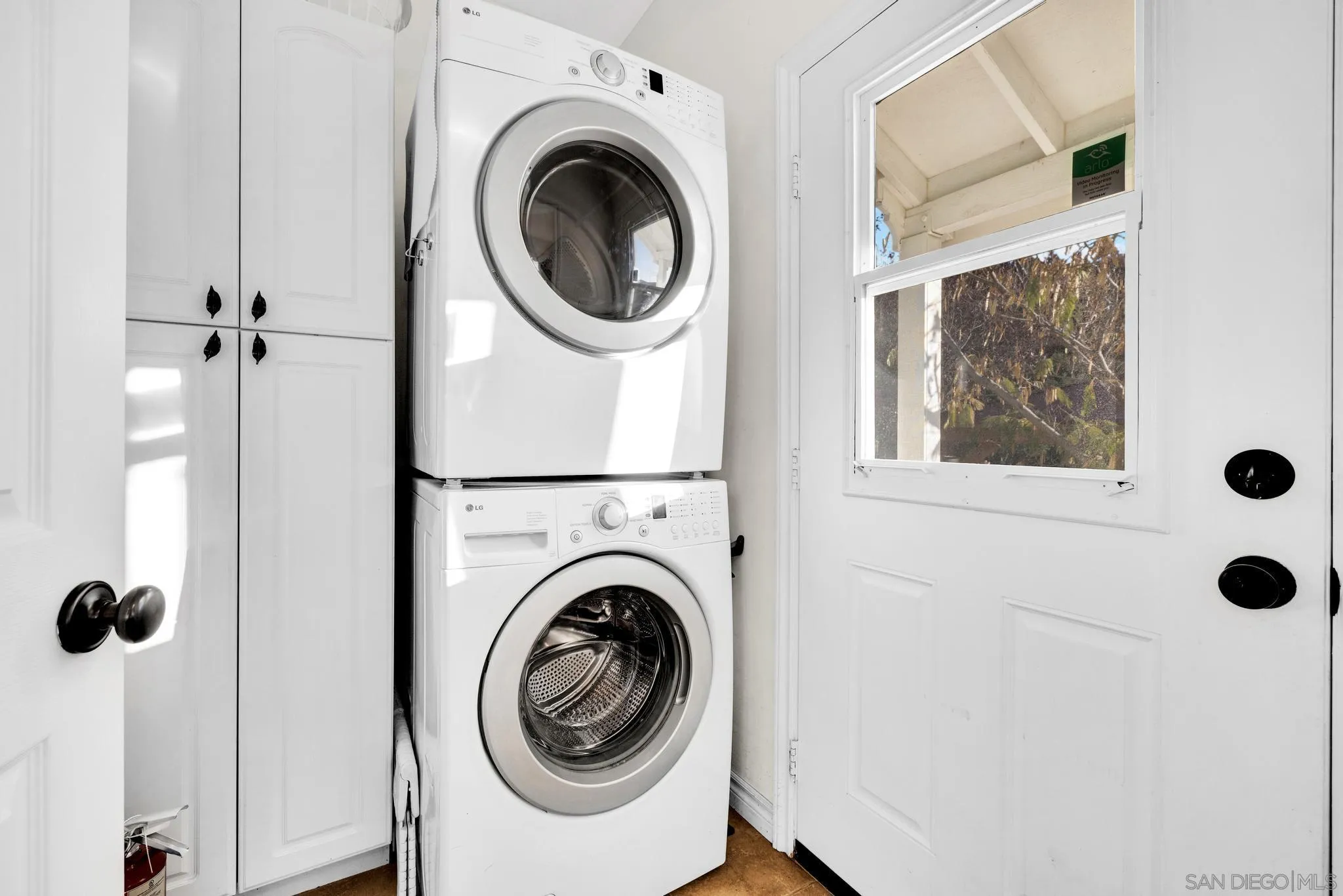 17735 Harrison Park Road Julian, CA 92036 - Photo 28 of 43 a view of a hallway with washer and dryer