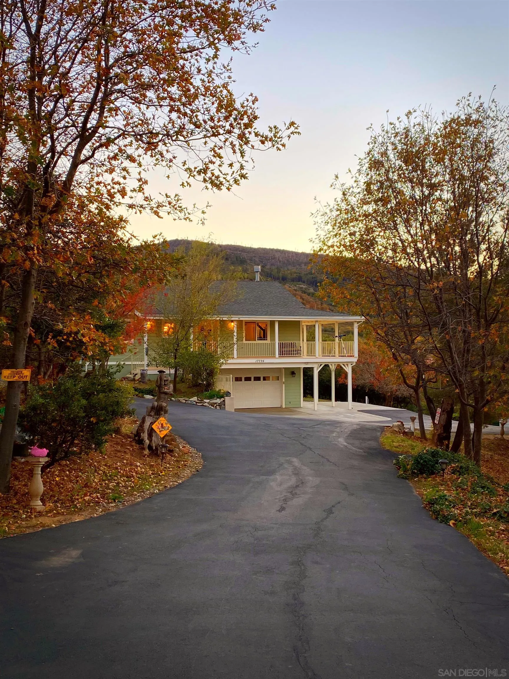 17735 Harrison Park Road Julian, CA 92036 - Photo 6 of 43 a front view of a house with a yard and garage