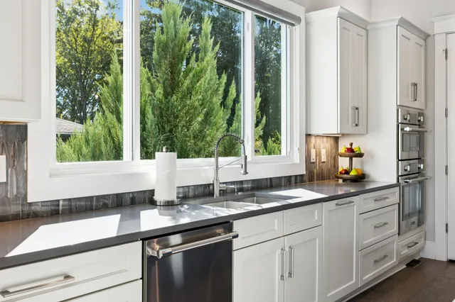 a large kitchen with a table and chairs