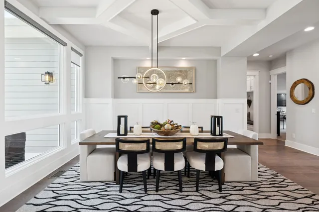 a living room with furniture windows and wooden floor