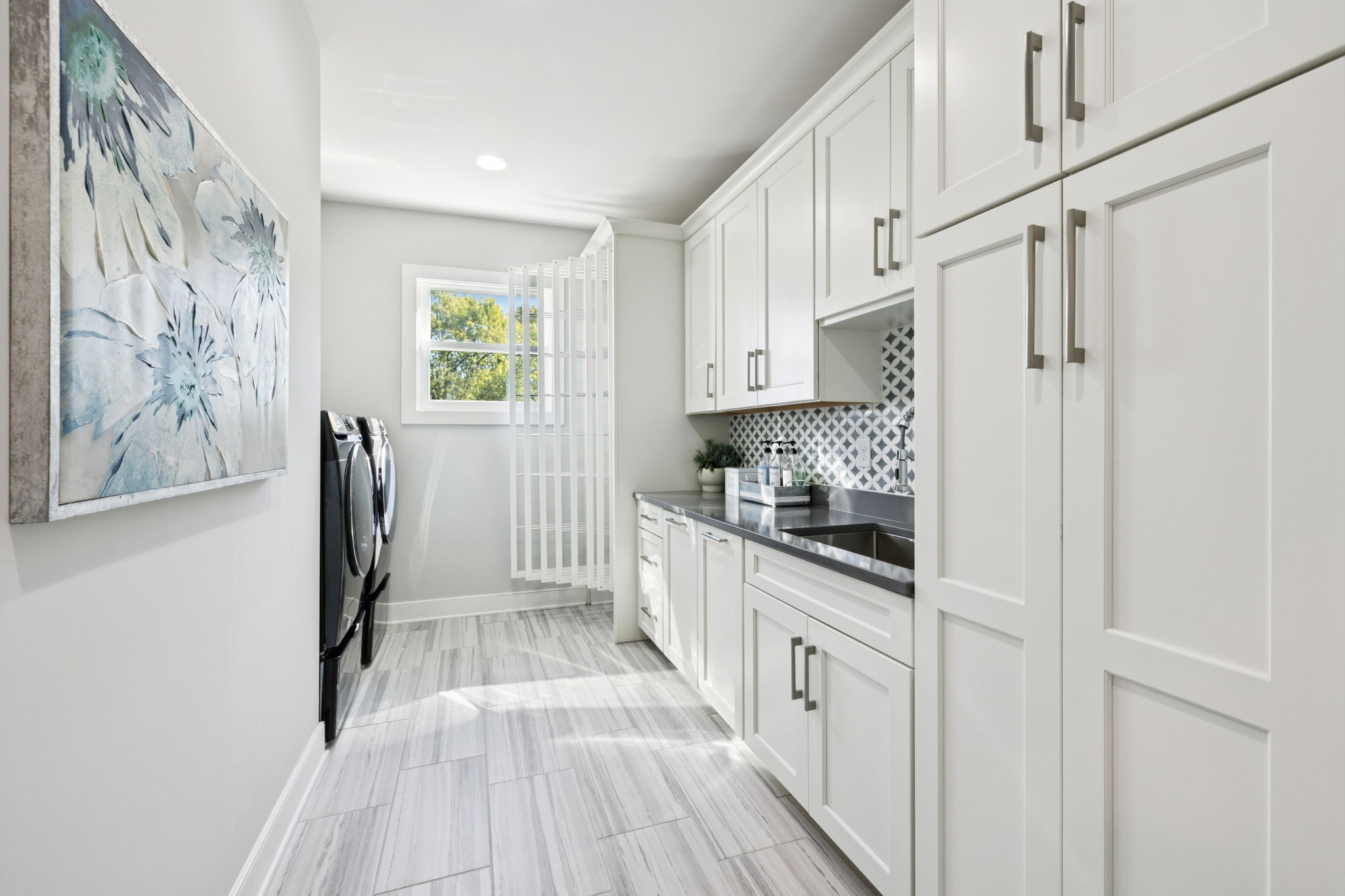 809 Burton Point Road Mount Juliet, TN 37122 - Photo 32 of 75 a kitchen with granite countertop white cabinets and white appliances