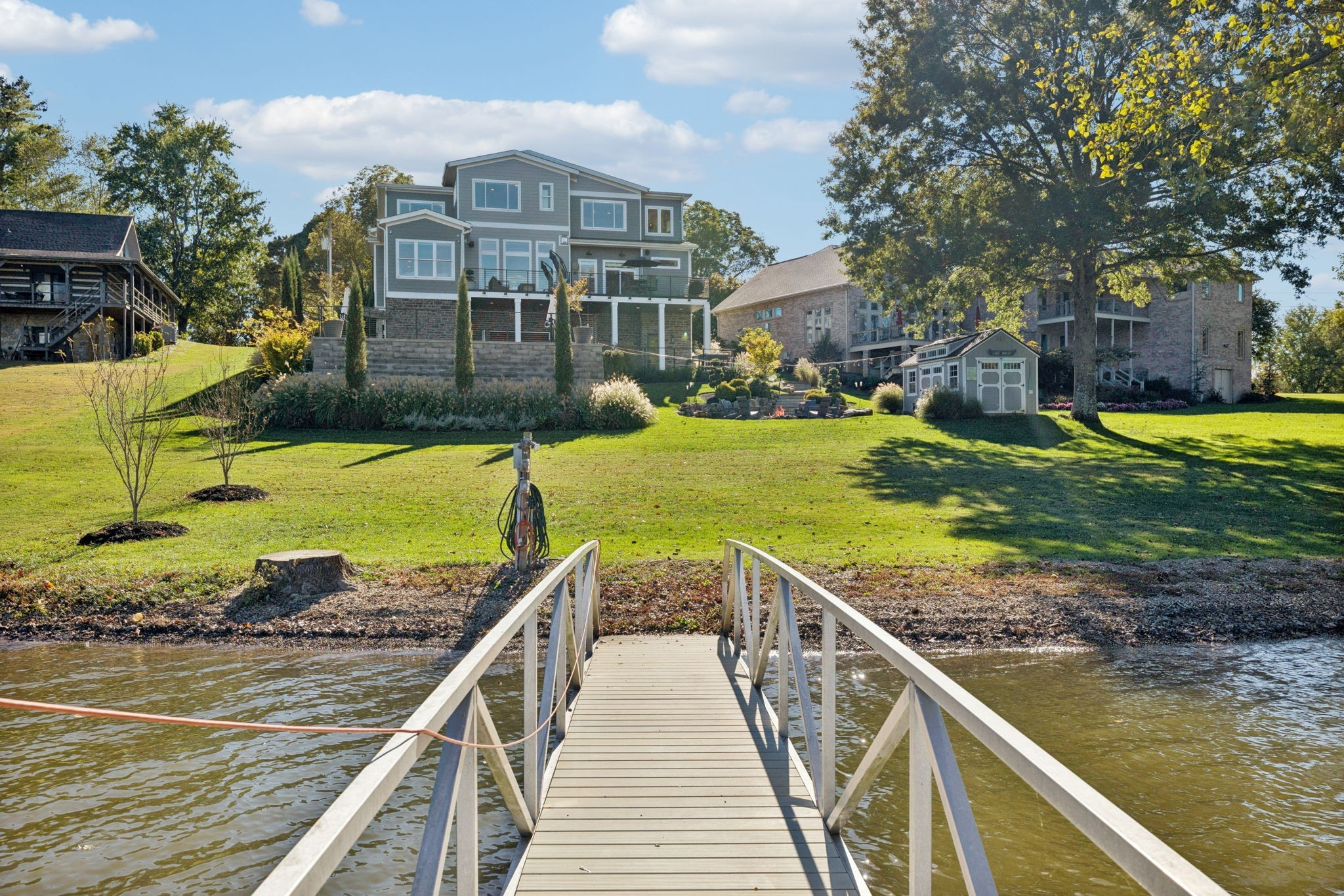 809 Burton Point Road Mount Juliet, TN 37122 - Photo 60 of 75 a view of a wooden deck and a yard