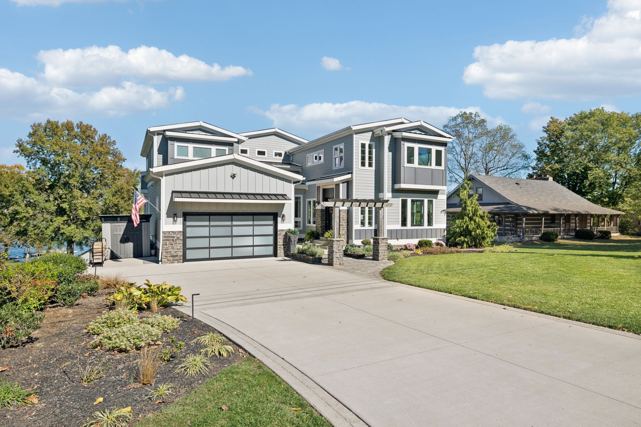 809 Burton Point Road Mount Juliet, TN 37122 - Photo 6 of 75 a front view of a house with a yard and garage