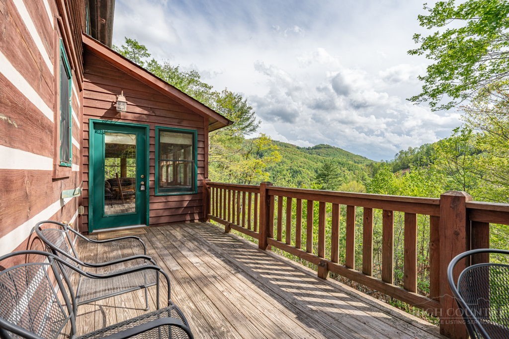197 Woodby Ridge Road Vilas, NC 28692 - Photo 3 of 45 a view of a chairs on the roof deck