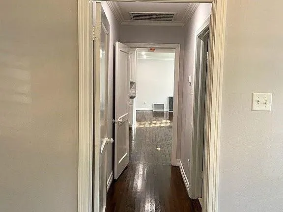 a view of a bathroom from a hallway