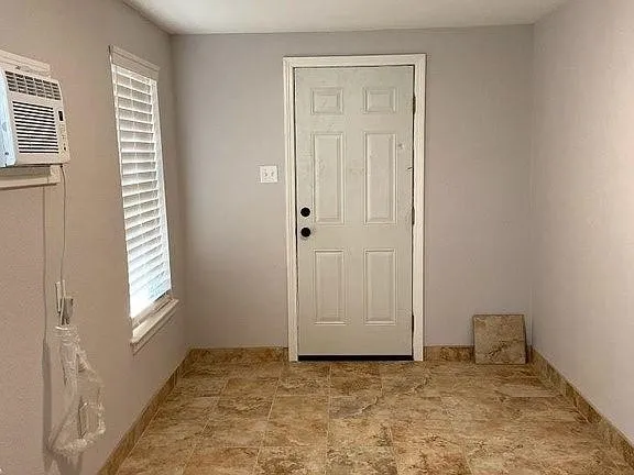 an empty room with windows