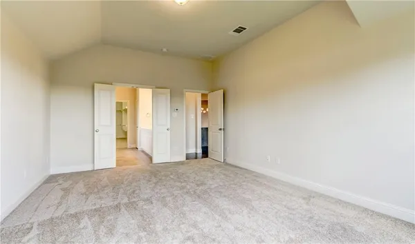 a view of a big room with closet and bathroom
