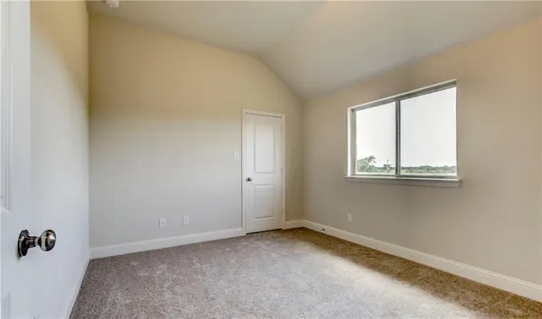 a view of a room that has a window in it