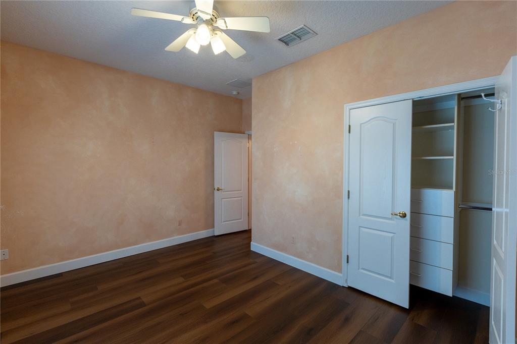 65 Calliope Street Ocoee, FL 34761 - Photo 30 of 60 an empty room with wooden floor closet and windows