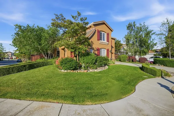 a front view of a house with a yard
