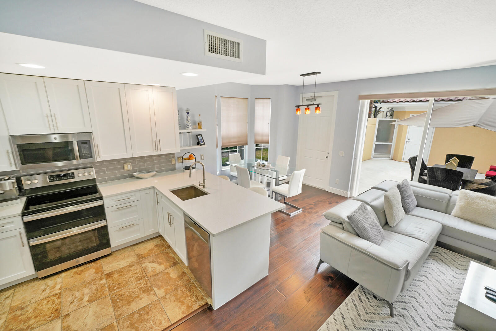 1615 Frederick Small Road Jupiter, FL 33458 - Photo 12 of 32 a view of kitchen with sink microwave and stove