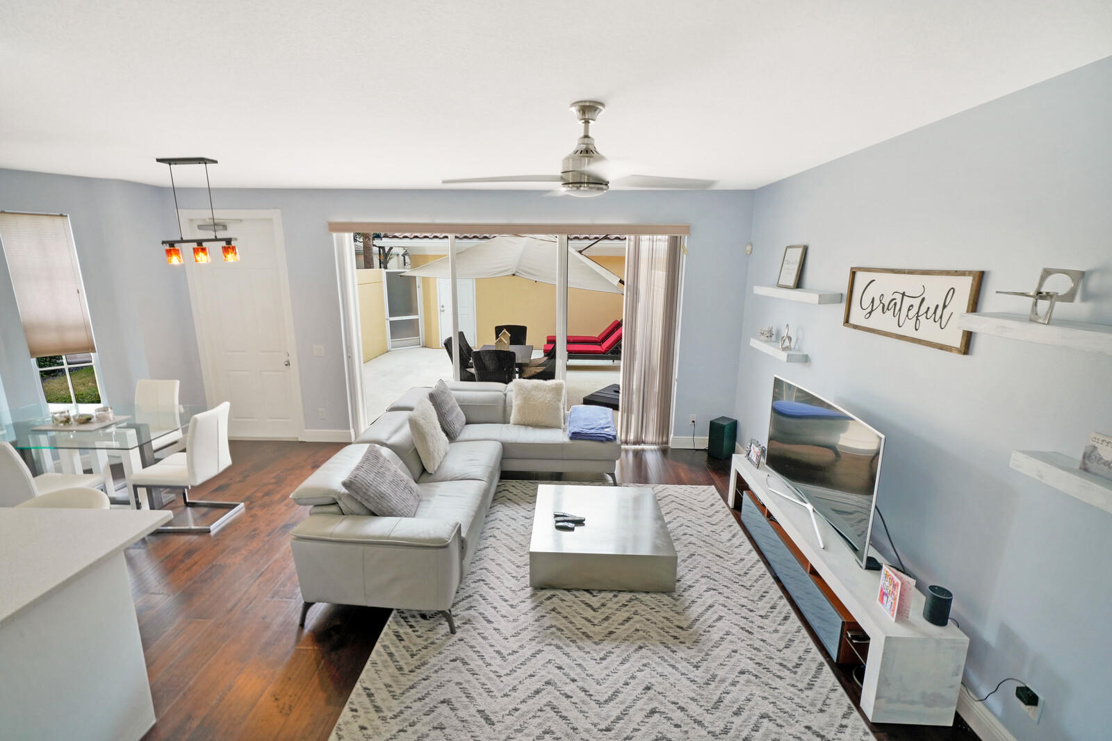 1615 Frederick Small Road Jupiter, FL 33458 - Photo 13 of 32 a living room with furniture and a fireplace