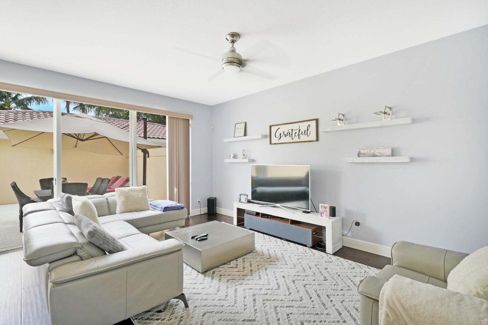 1615 Frederick Small Road Jupiter, FL 33458 - Photo 14 of 32 a living room with furniture and a flat screen tv