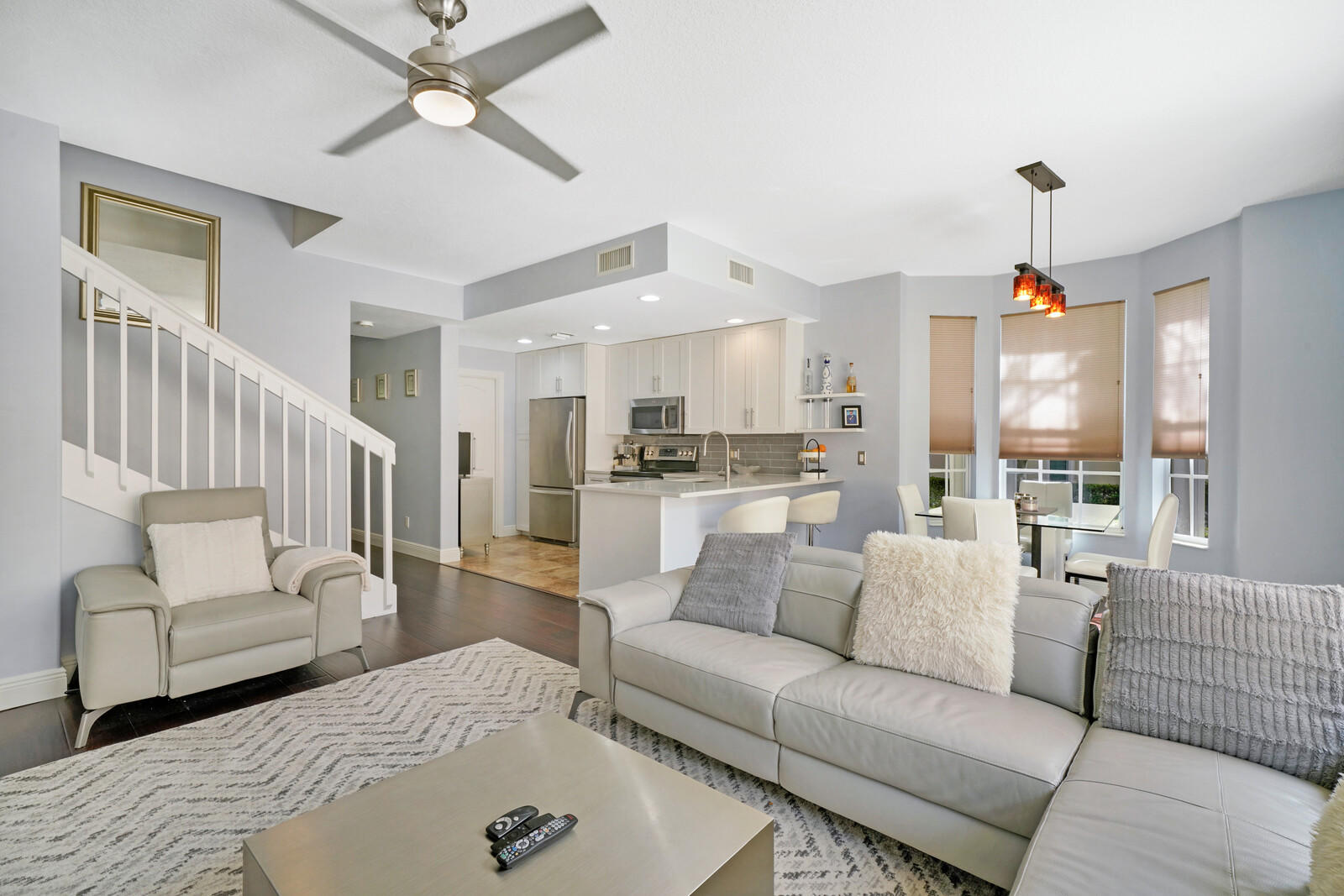 1615 Frederick Small Road Jupiter, FL 33458 - Photo 16 of 32 a living room with furniture and a chandelier