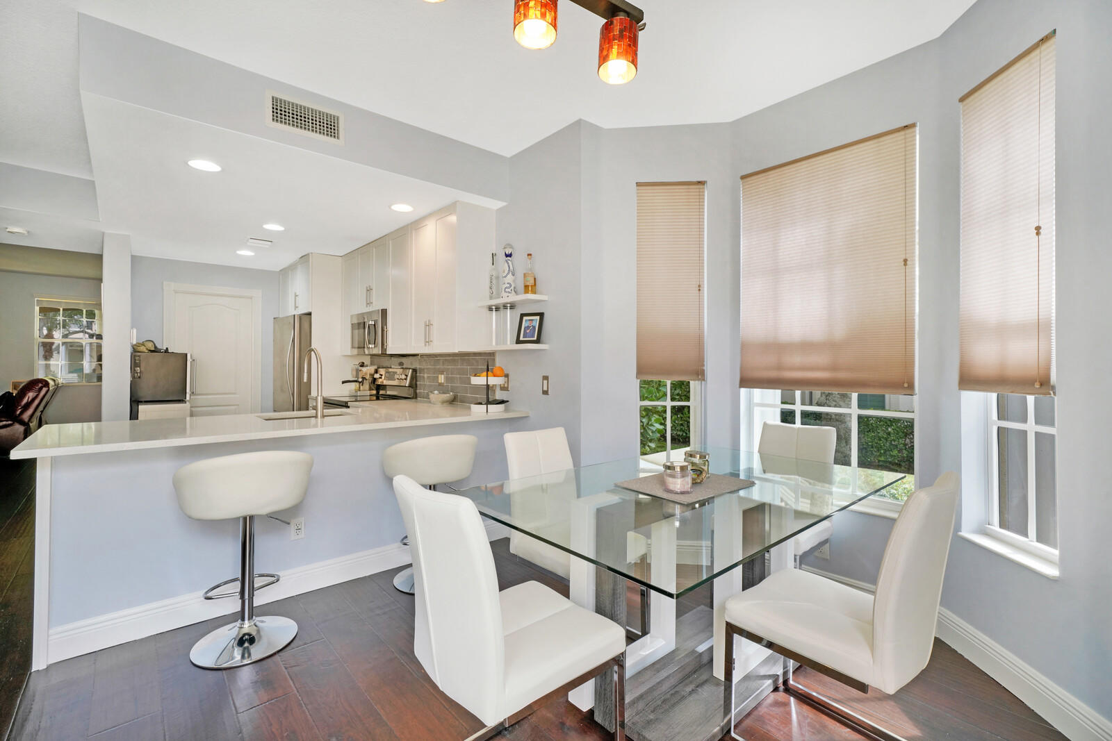 1615 Frederick Small Road Jupiter, FL 33458 - Photo 17 of 32 a view of a dining room with furniture window and wooden floor