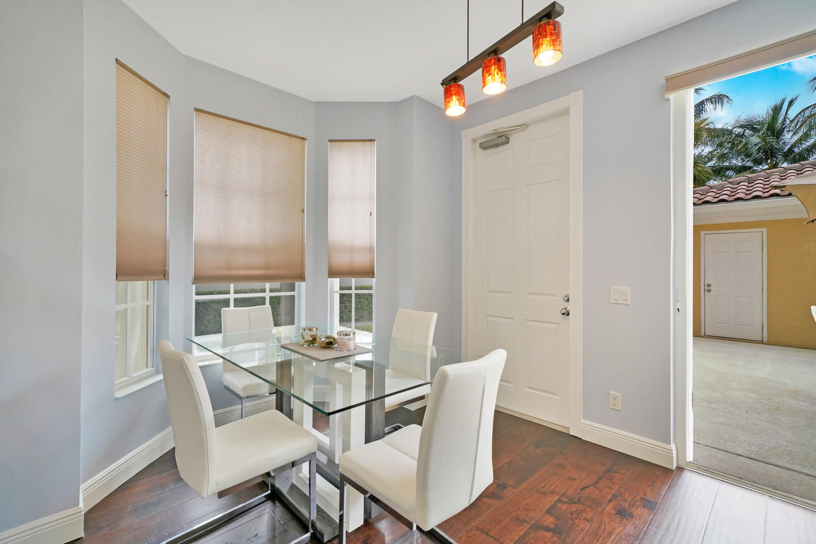 1615 Frederick Small Road Jupiter, FL 33458 - Photo 18 of 32 a dining room with furniture and wooden floor