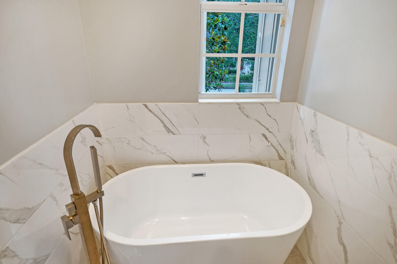 1615 Frederick Small Road Jupiter, FL 33458 - Photo 24 of 32 a white bath tub sitting in a bathroom