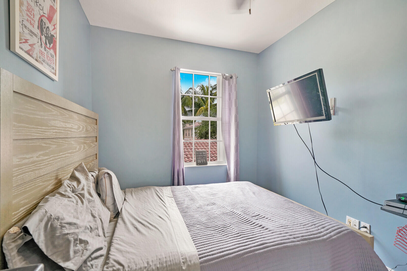 1615 Frederick Small Road Jupiter, FL 33458 - Photo 27 of 32 a bedroom with a bed and a window