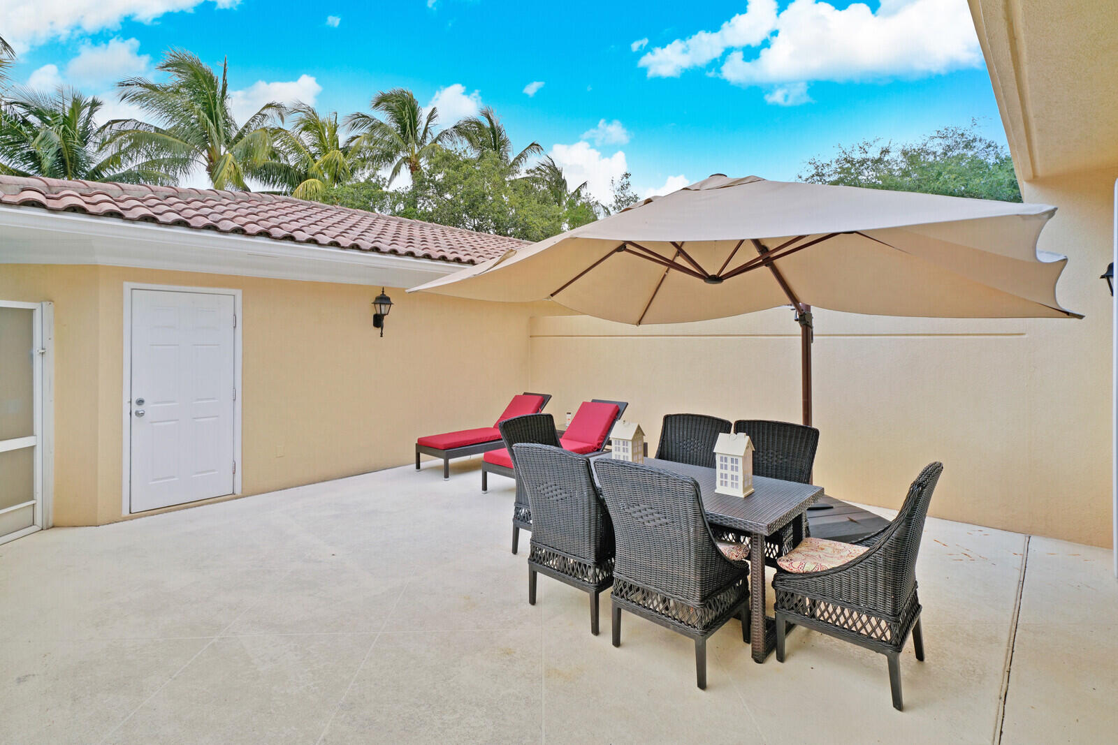 1615 Frederick Small Road Jupiter, FL 33458 - Photo 29 of 32 a view of a chairs and table in the patio