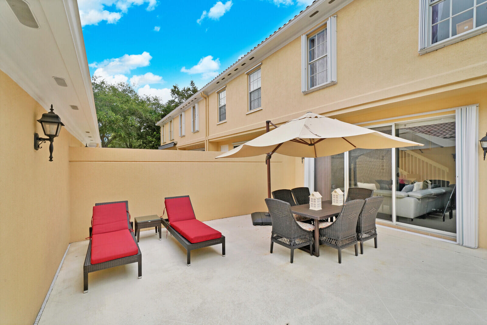 1615 Frederick Small Road Jupiter, FL 33458 - Photo 30 of 32 a backyard of a house with outdoor seating