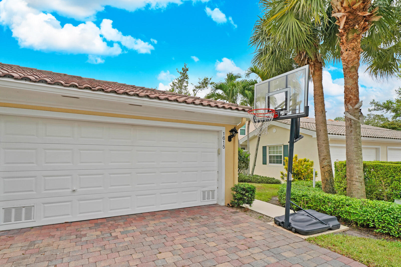 1615 Frederick Small Road Jupiter, FL 33458 - Photo 32 of 32 a front view of a house with a yard and garage