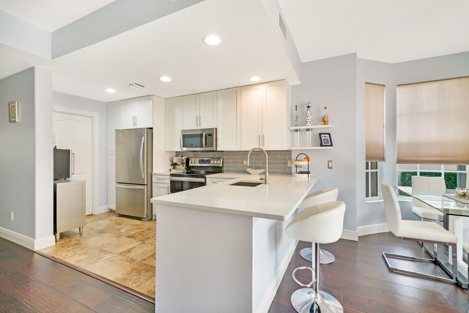 1615 Frederick Small Road Jupiter, FL 33458 - Photo 10 of 32 a large kitchen with a table and chairs