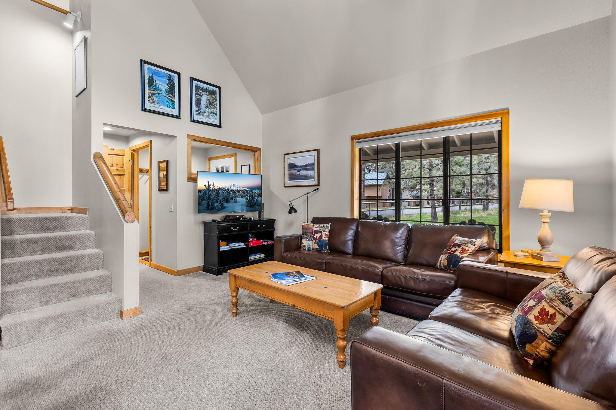 57505 Circle 4 Cabin Road, Unit 29 Sunriver, OR 97707 - Photo 11 of 35 a living room with furniture and a flat screen tv
