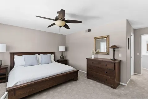 a view of a dining room with furniture and a potted plant