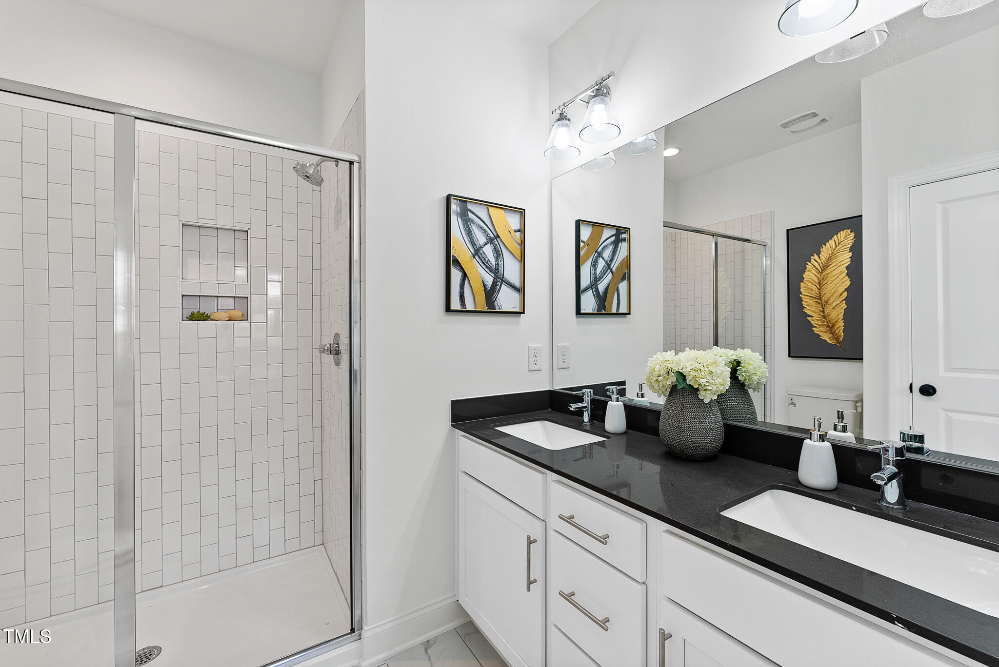 4820 Gossamer Lane, Unit 101 Raleigh, NC 27616 - Photo 12 of 41 a bathroom with a granite countertop sink a mirror a vanity and shower
