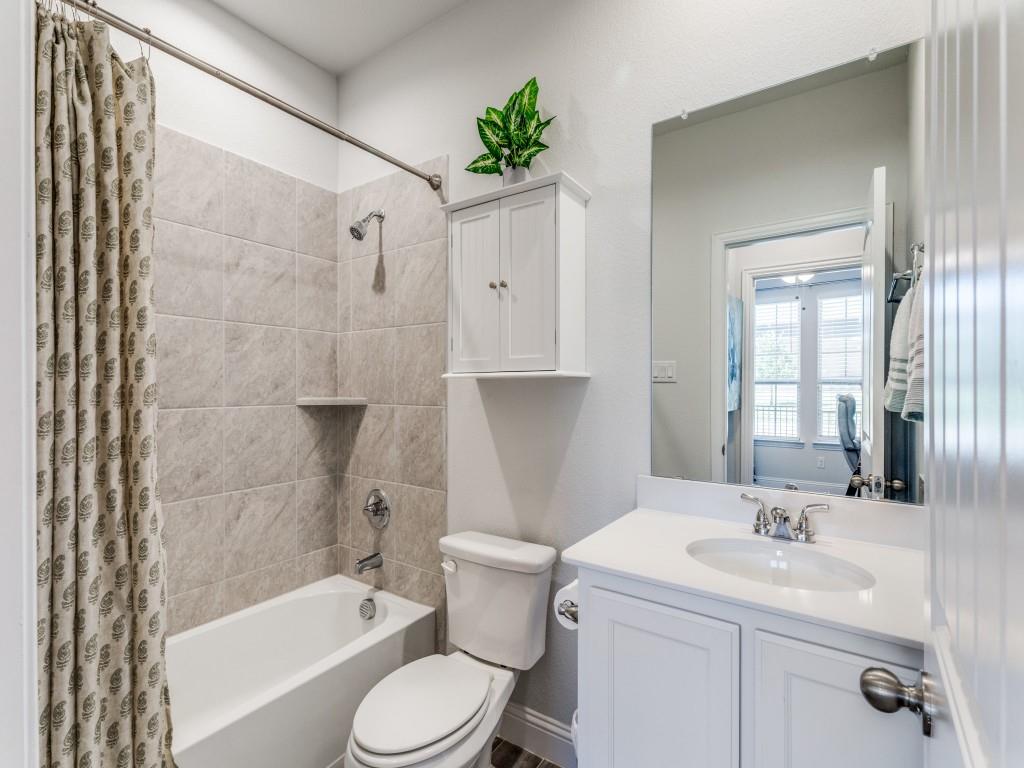 5944 Bursey Road Watauga, TX 76148 - Photo 23 of 25 a bathroom with a sink a toilet and shower