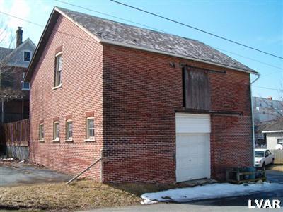 31 North 3rd Street Coplay, PA 18037 - Photo 10 of 11 a brick building with a street sign on it