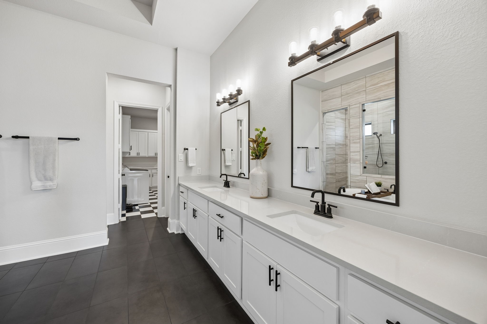 10102 South Goshawk Trail Conroe, TX 77385 - Photo 35 of 46 a bathroom with double sink and a mirror