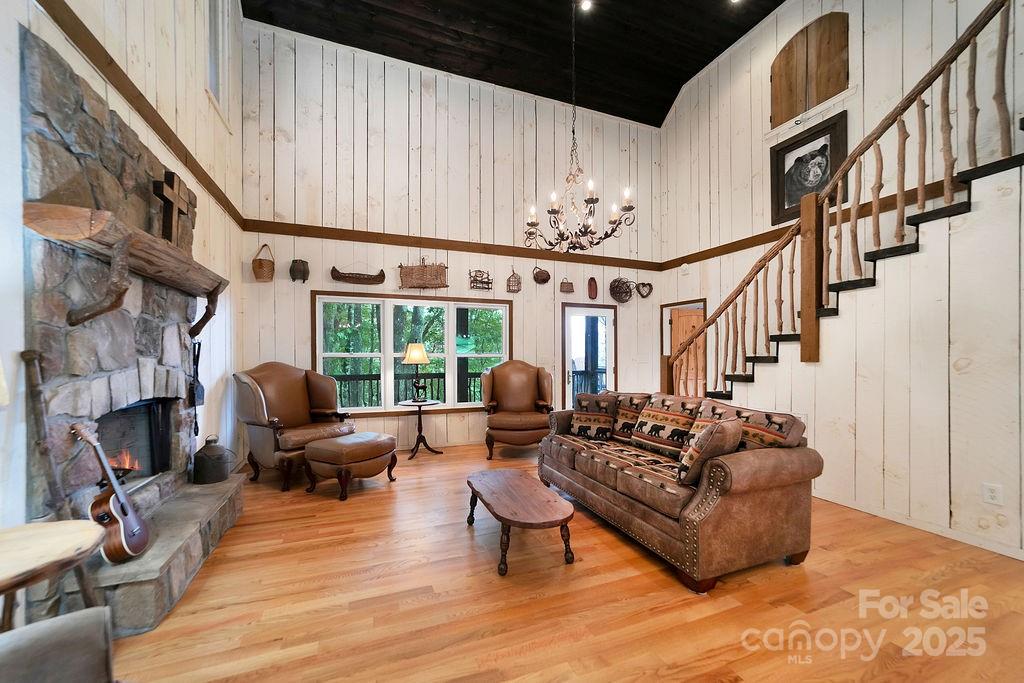 418 Sandy Lane Brevard, NC 28712 - Photo 18 of 45 a living room with fireplace furniture and a floor to ceiling window